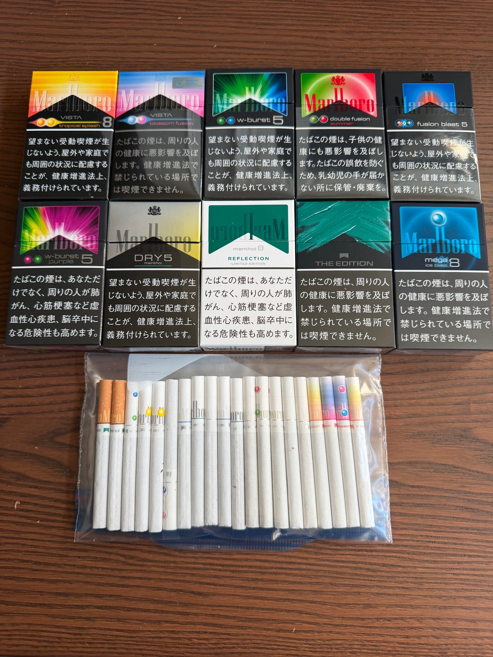 Malboro sample bag with ten pictured Marlboro varieties and sample cigarettes