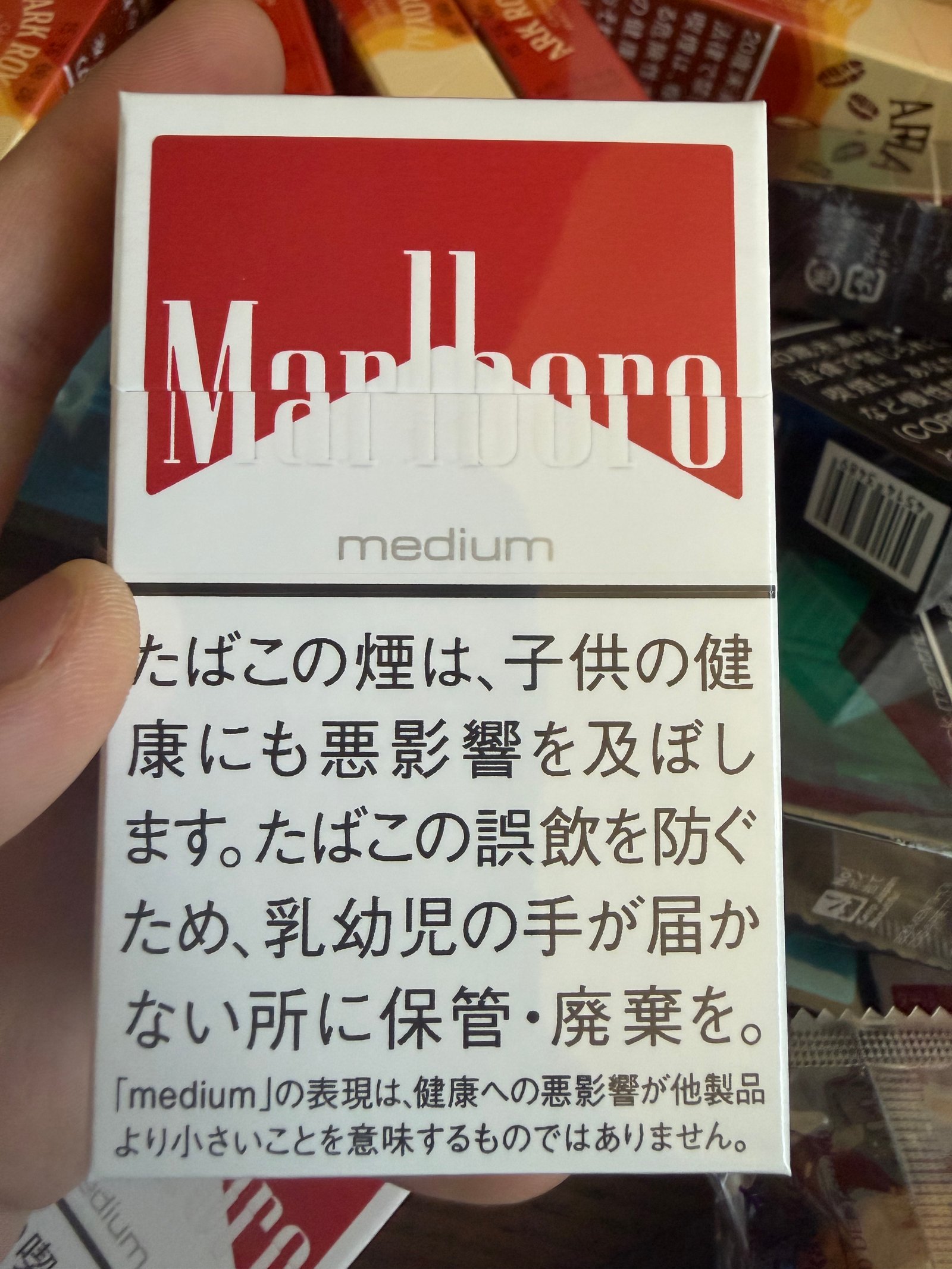 White and red Marlboro package front with visible Marlboro and medium wording
