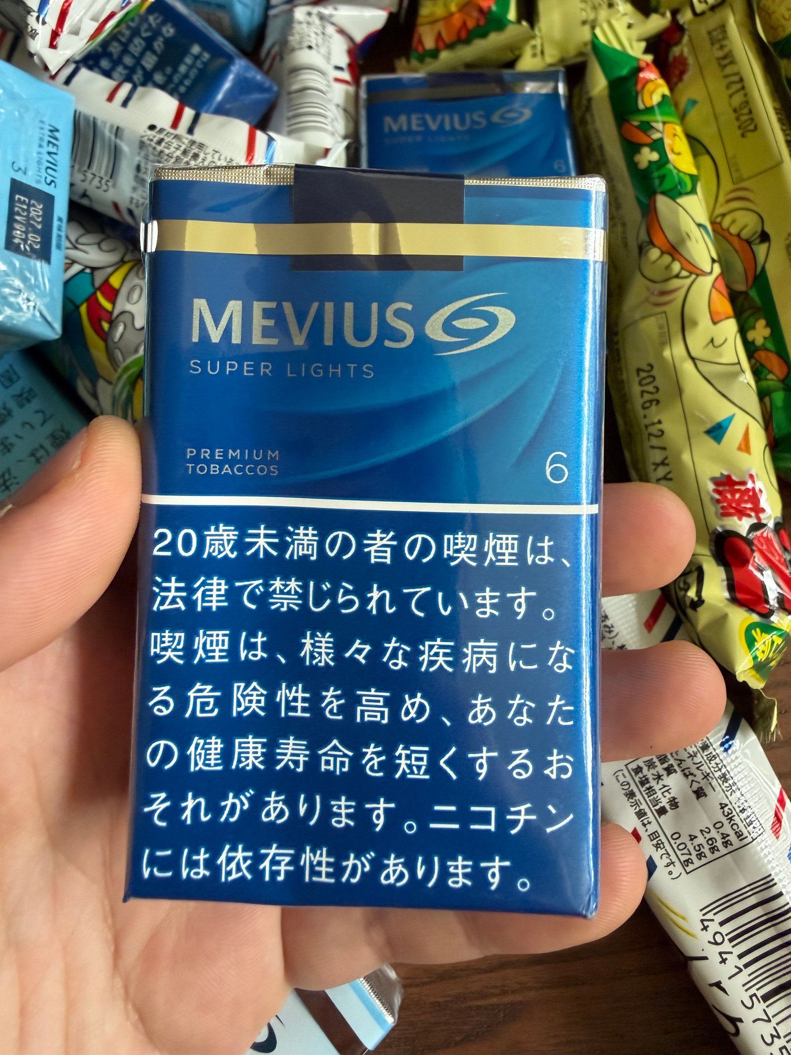 Dark-blue Mevius Super Lights Premium Tobaccos pack marked 6